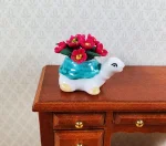 Magenta Flowers in a Ceramic Turtle Planter (image for) Magenta Flowers in a Ceramic Turtle Planter